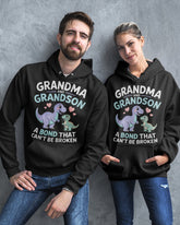 Black unisex dinosaur T-shirt featuring grandma and grandson bond design, from TEELUVS.COM.