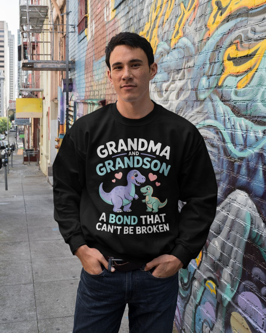 Unisex black dinosaur T-shirt from TEELUVS.com featuring a grandma and grandson bond graphic, perfect for kids and family matching.
