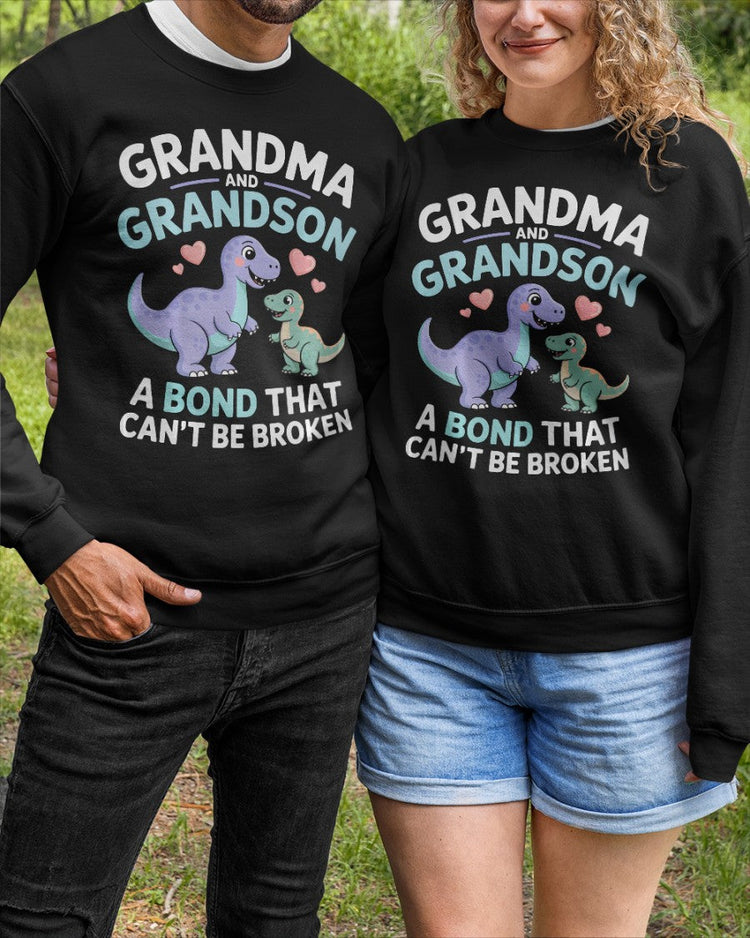 Black unisex dinosaur T-shirt from TEELUVS.COM featuring a grandma and grandson bond design, perfect for kids and family wear.