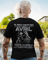 Black T-shirt featuring the phrase "Ne jamais sous-estimer le pouvoir d’un homme né en avril" in bold white text, male fit.