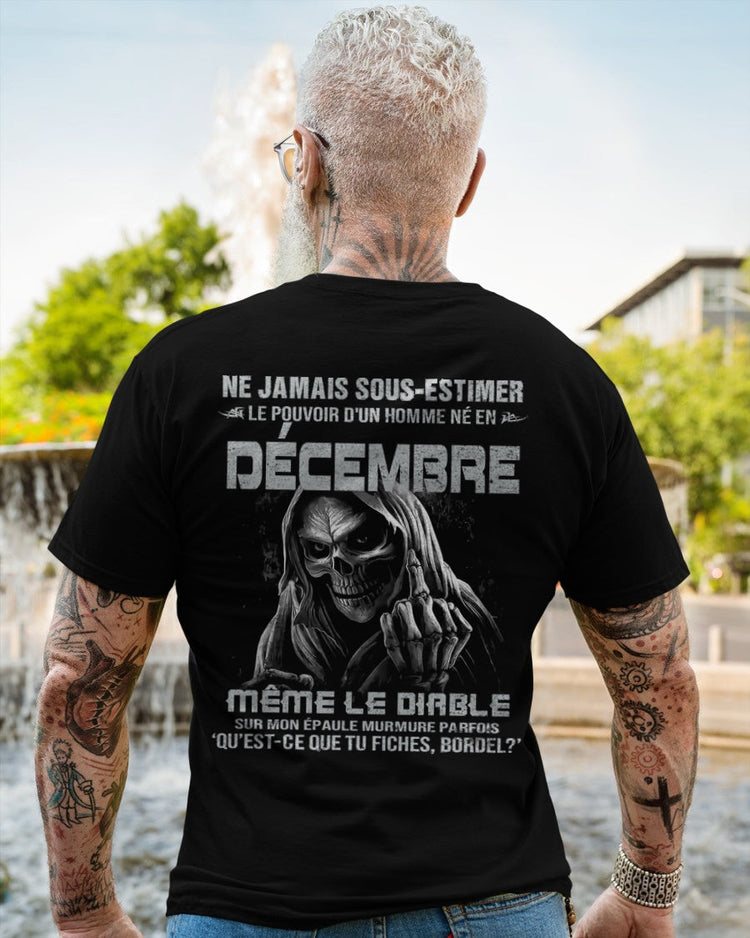 Black T-shirt for men born in December with "Never Underestimate the Power of a December Man" text, by TEELUVS.COM.