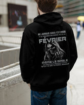 Black T-shirt for men born in February with "Never Underestimate the Power of a Man Born in February" slogan, by TEELUVS.COM.
