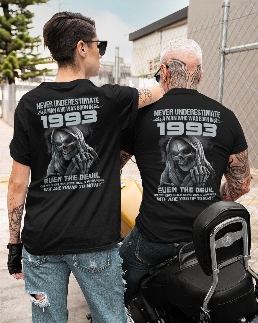 Black TEELUVS.COM T-shirt featuring "Never Underestimate Us 1993" slogan, casual fit, front view.