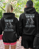 Black TEELUVS.com T-shirt with "Never Underestimate Us 1993" print, casual fit, front view.