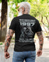 Black TEELUVS.COM T-shirt featuring "Never Underestimate Us 1997" printed design, front view, size S.
