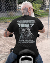 Black TEELUVS.COM T-shirt featuring "Never Underestimate Us1997" graphic, front view, casual style, size S.