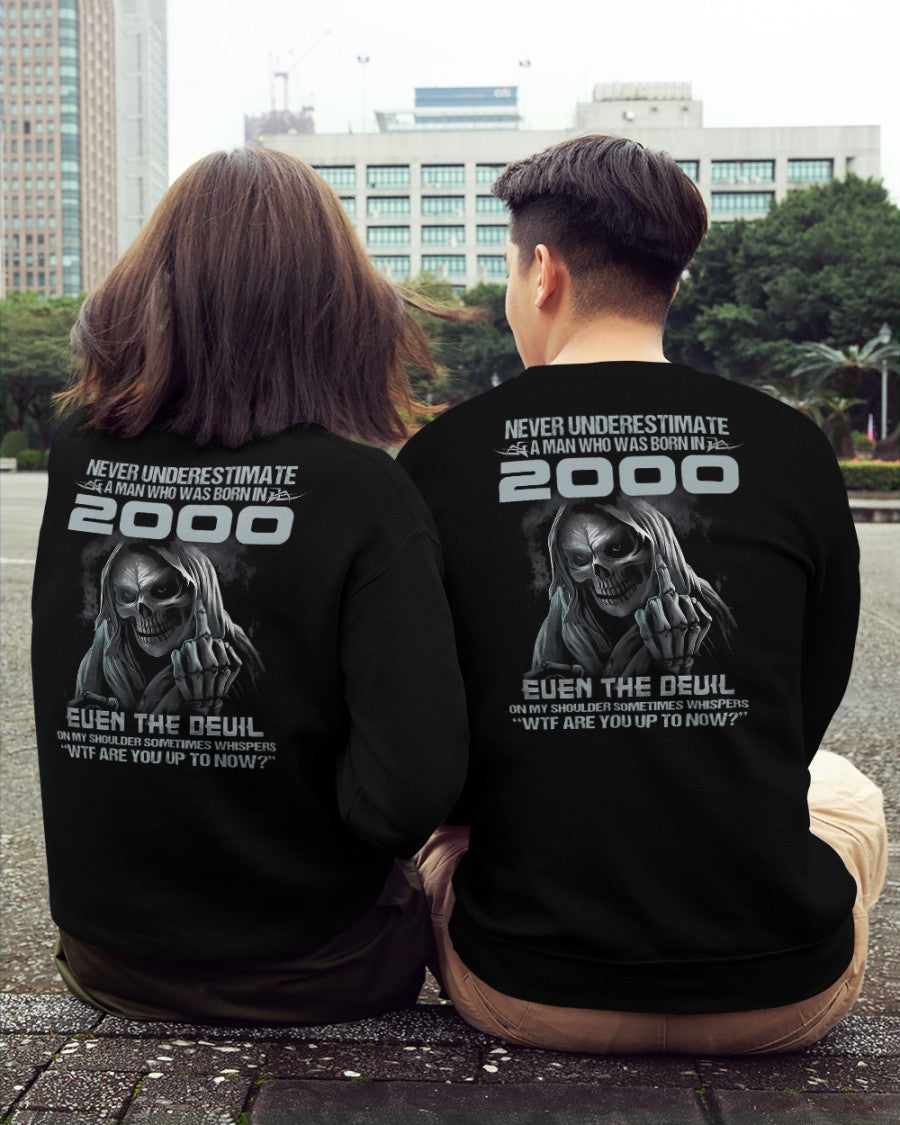 Black T-shirt for men with "Never Underestimate US2000" print, from TEELUVS.COM, displayed on a male model.