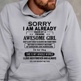 White T-shirt for wife with playful text "Sorry I Am Already Taken By A Freaking Awesome Girl," from TEELUVS.COM.