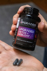 Upgraded Formulas® Detox and Debloat Capsules, 90-count supplement bottle with capsules for digestion and cleansing.