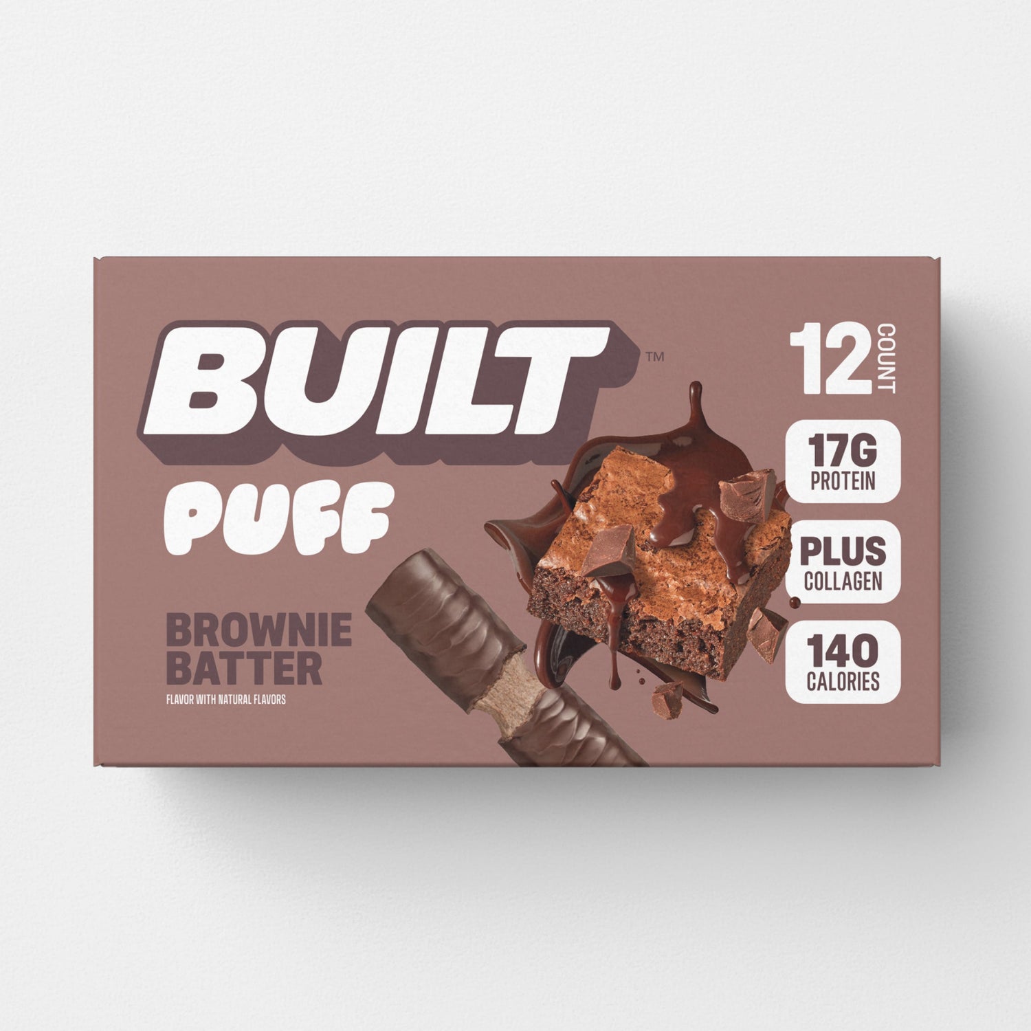 Built Brownie Batter Puff snack bar with chocolate flavor, displayed in a carton, showcasing the fluffy, brownie-inspired puff texture.